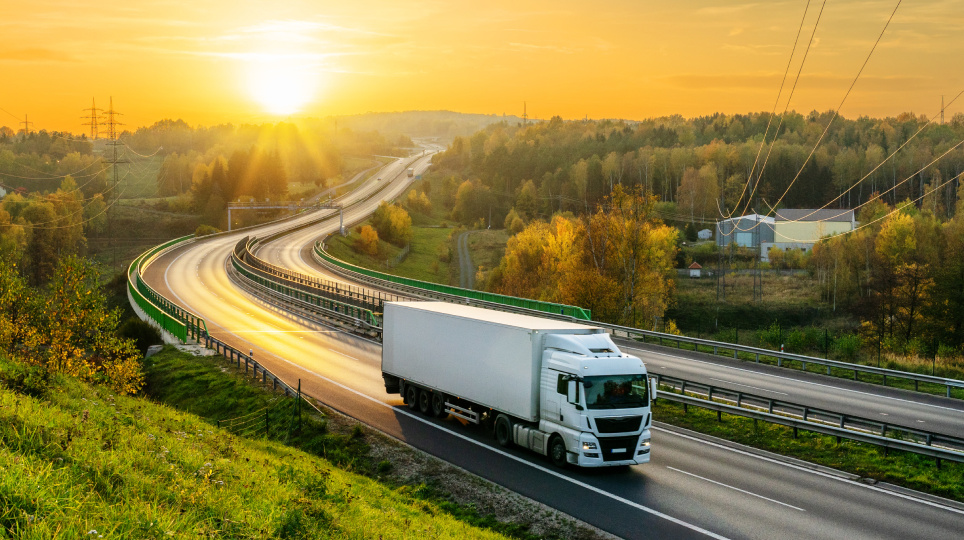 Carrier on road with sunsetting